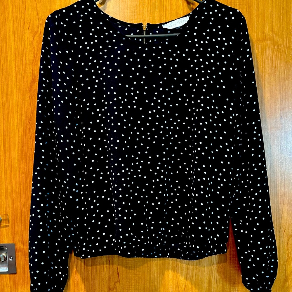 Hippie Rose small, black blouse with white polka dots.